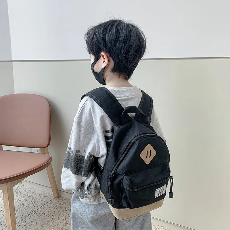 Children School Bags Girls Boys Primary School Backpack Orthopedic Canvas Solid Color Backpack Schoolbag Kids Book Bag Infantil