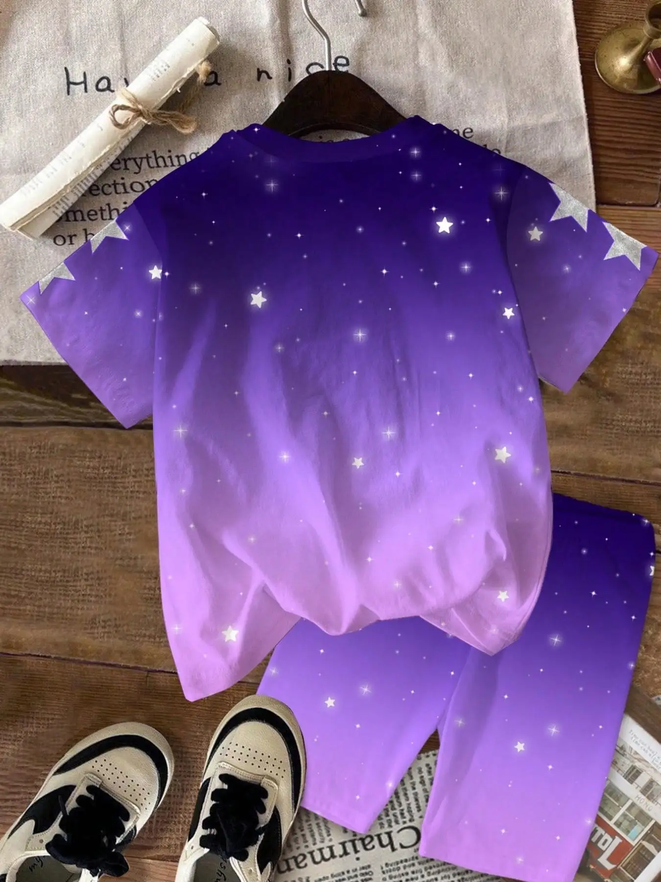 Girls' two-piece set featuring a purple gradient, anime-style star print, and Korean-inspired aesthetic; includes a crew-neck sh