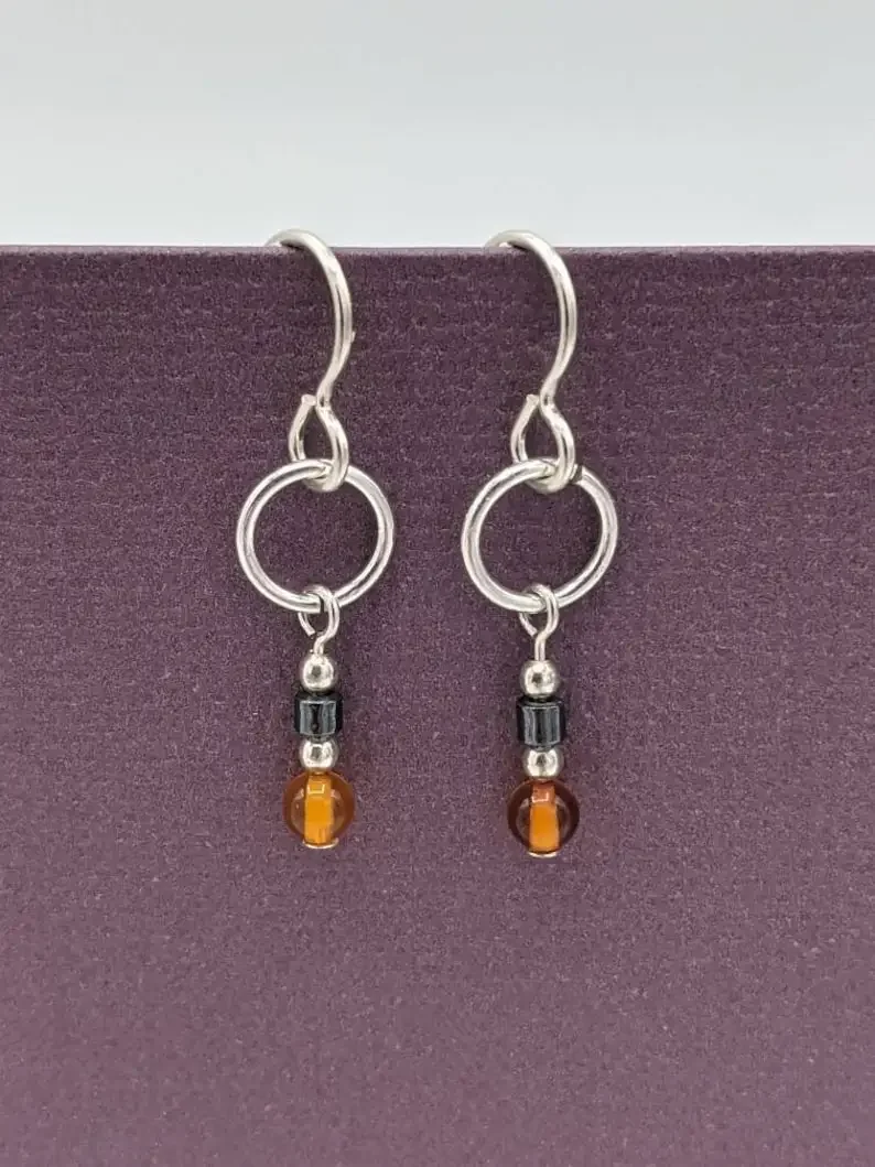 Amber earrings, small ring pendant earrings, real amber and hematite earrings