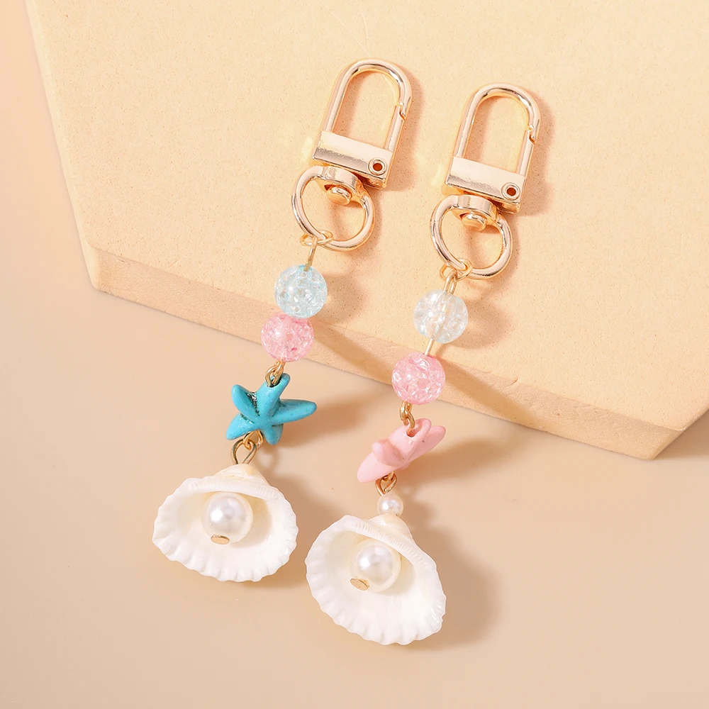 Aihua Chic Perlen-Seestern-Muschel-Schlüsselanhänger für Damen und Mädchen, Handtaschen- und Rucksackanhänger, Schlüsselring, Schmuckgeschenke – Detail 1