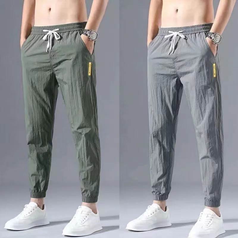 

Pantalones con cordón de cintura media para hombre, pantalones de chándal de poliéster con bolsillos y cordones, de verano