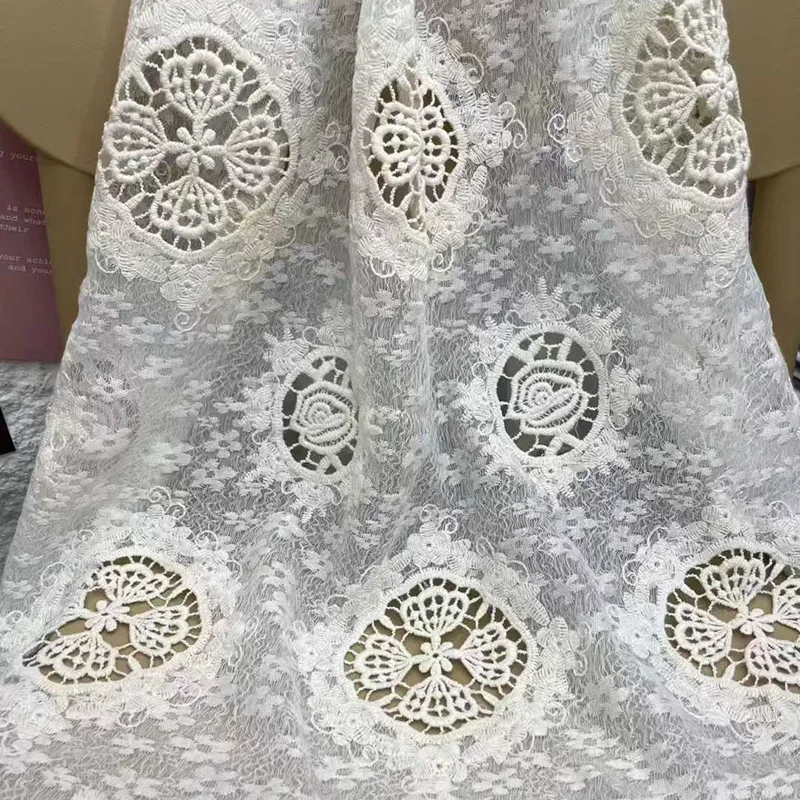 

New high-end embroidered round hollow floral geometric lace fabric for women's dresses designed for sewing by designer
