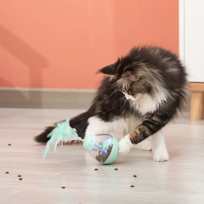 Spot leaking food ball led light feather electric toy, Amazon tumbler leaking food toy with bell