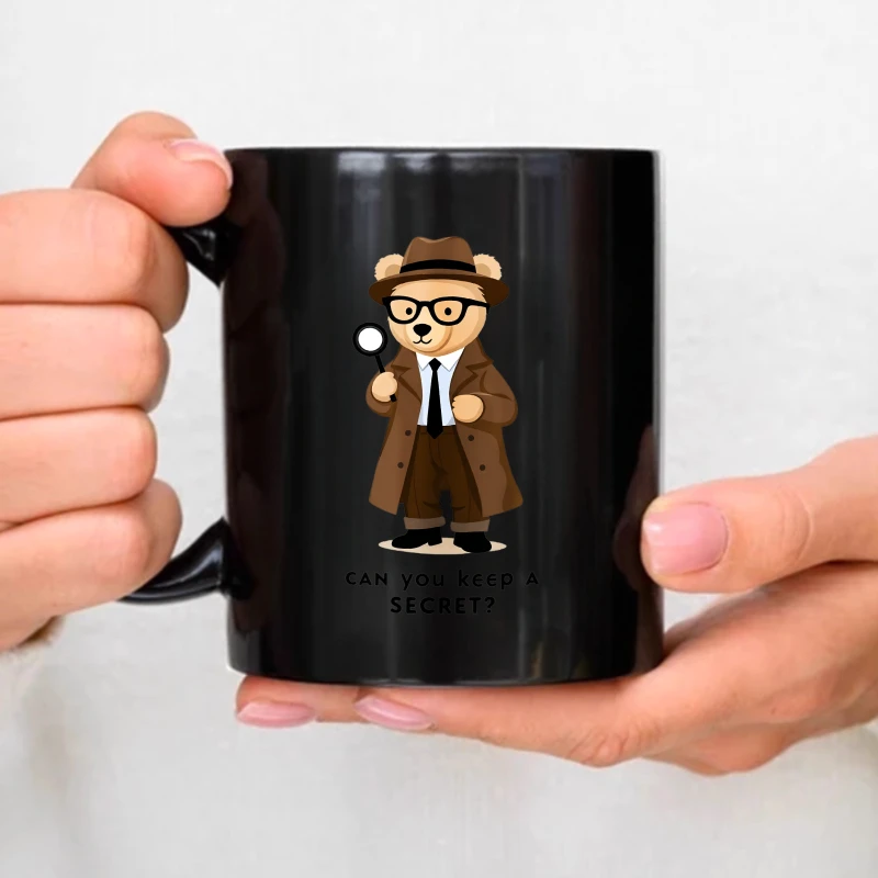Black ceramic mug with a detective bear cartoon and 