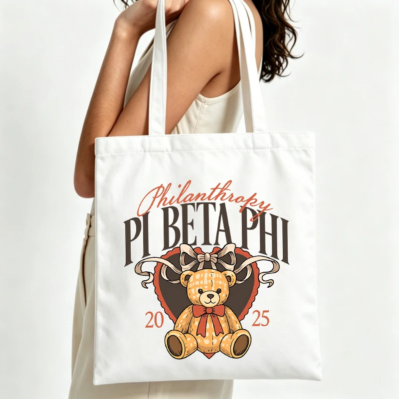 Sac fourre-tout en toile pour femme avec motif ours en peluche et cœur, imprimé typographique, idéal pour un usage quotidien décontracté et les événements caritatifs