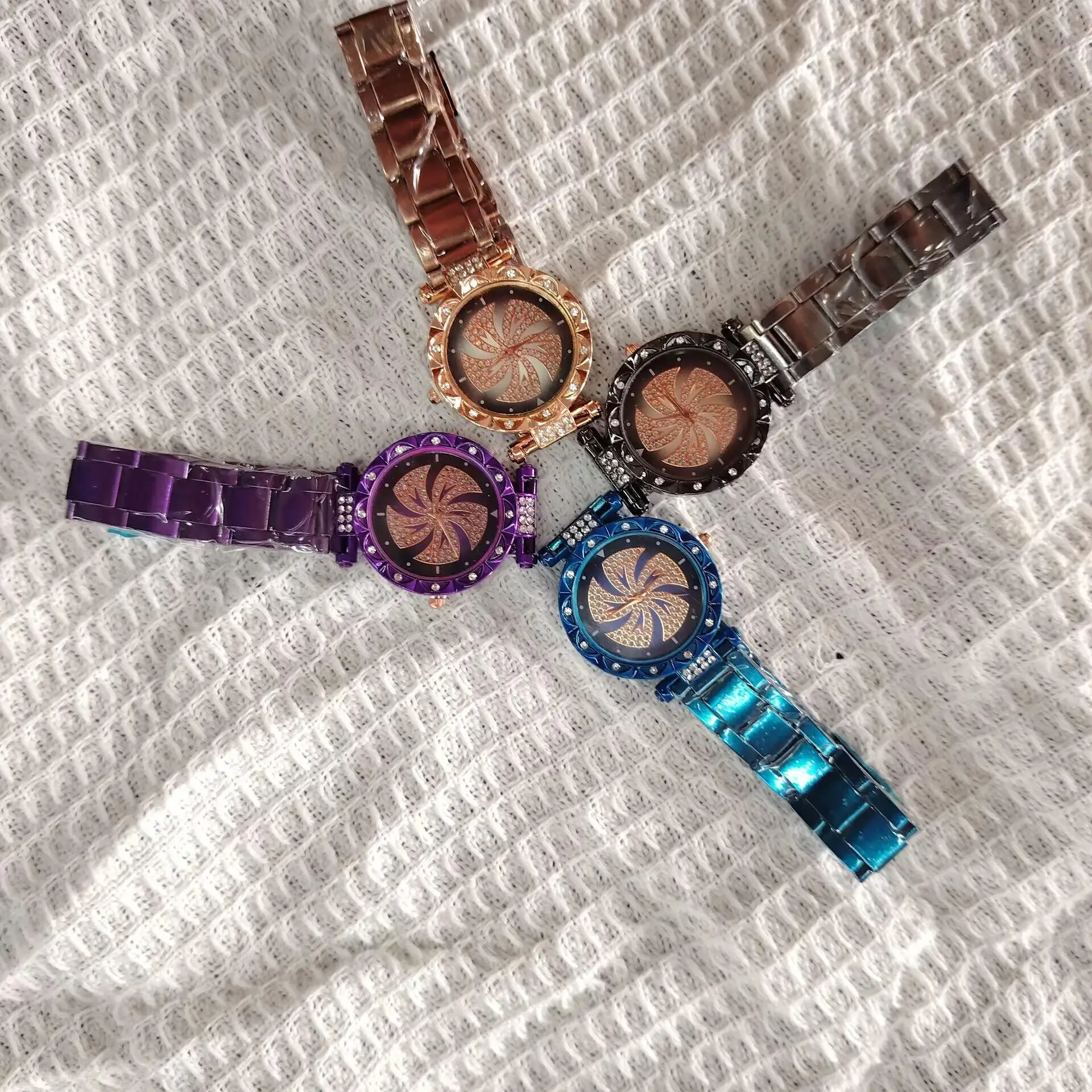 

New fashion rhinestone whirlwind pattern quartz steel strap watch fashion windmill decoration women's watches