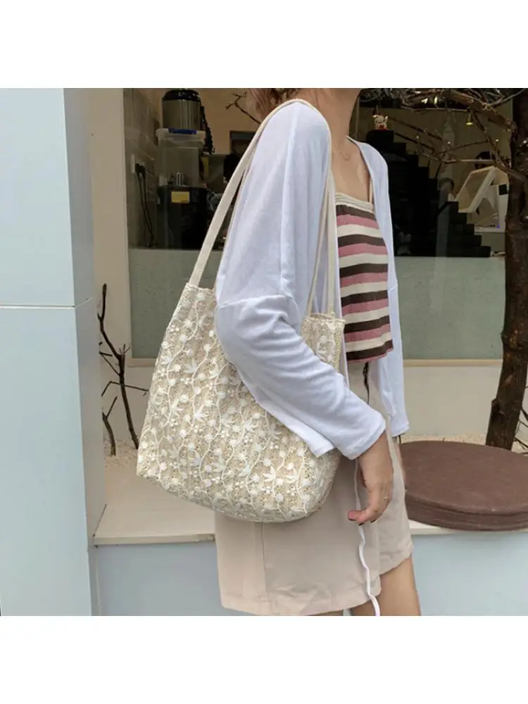 Fairy handbag 2023 han edition of the new fashion lace shoulder bag woven bucket bag joker straw bag