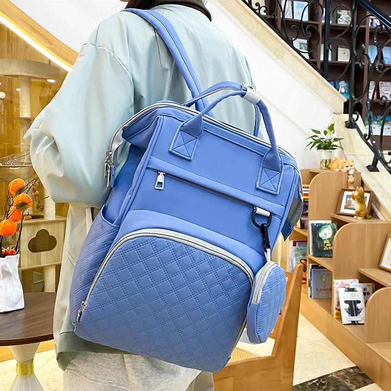 กระเป๋าเดินทางอเนกประสงค์กันน้ำพร้อมแผ่นรองเปลี่ยนผ้าอ้อม สายรัดรถเข็นเด็ก ขนาดใหญ่สำหรับคุณแม่ กระเป๋าเป้ใส่ผ้าอ้อมเด็ก อุปกรณ์จำเป็นสำหรับเด็ก