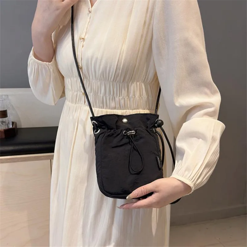 

Chic Nylon Mini Drawstring Crossbody Bag Soft Stylish Phone Wallet Pocket Lightweight Shoulder Purse Perfect for Women Daily Use