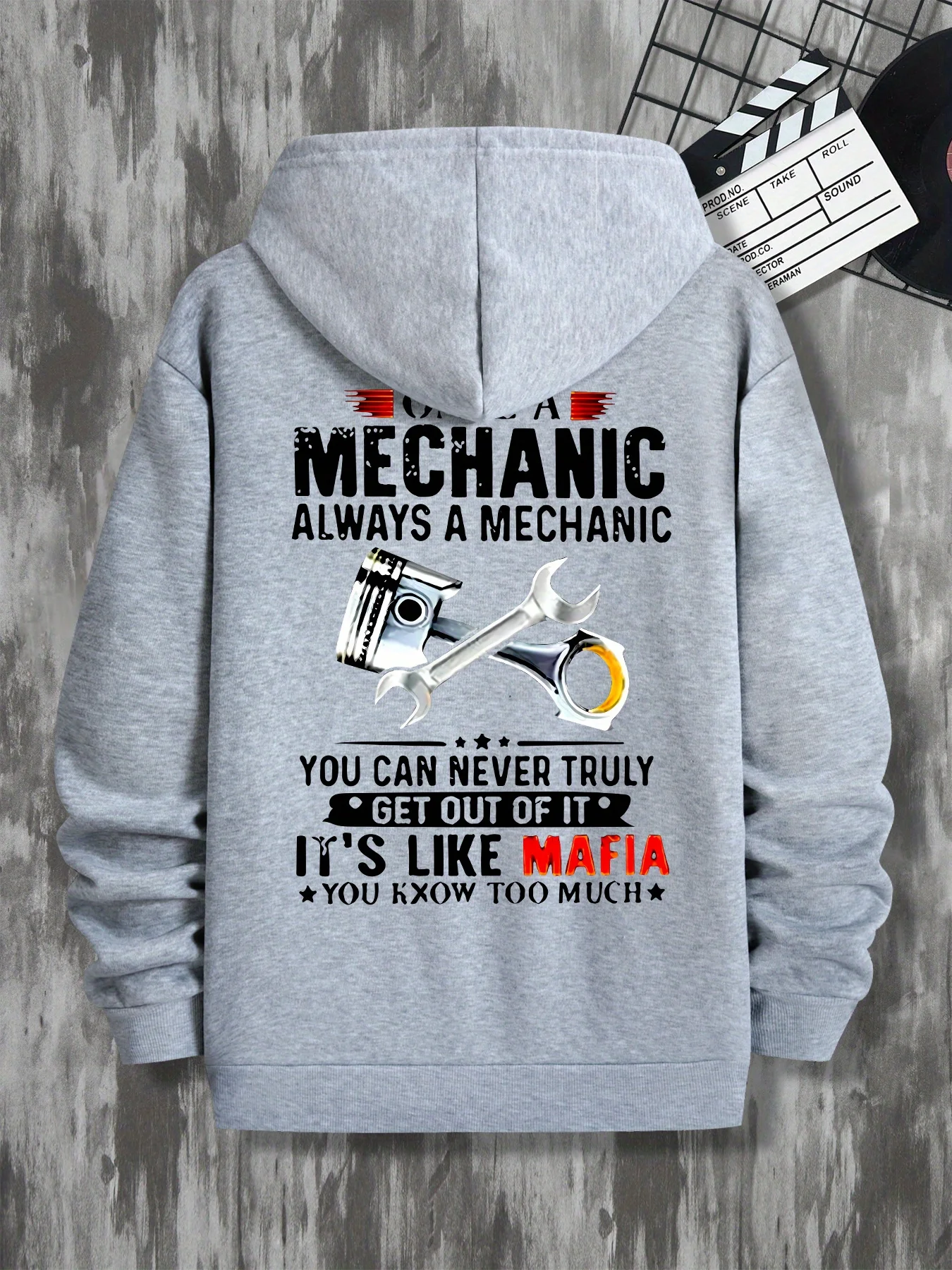 

Men's mechanic pattern hooded sweatshirt with a humorous print saying "Mechanic always escapes from the mafia"