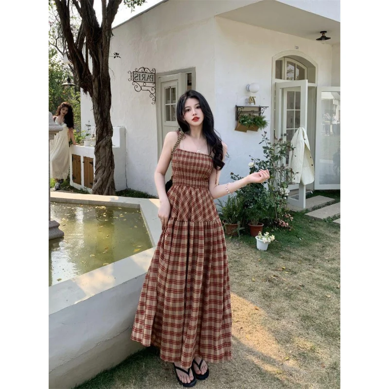 

French Style Tea Dress Women Summer 2025 Hot New Waist Slimming Plaid Mid-Length Sweet and Spicy Temperament Strap Dress