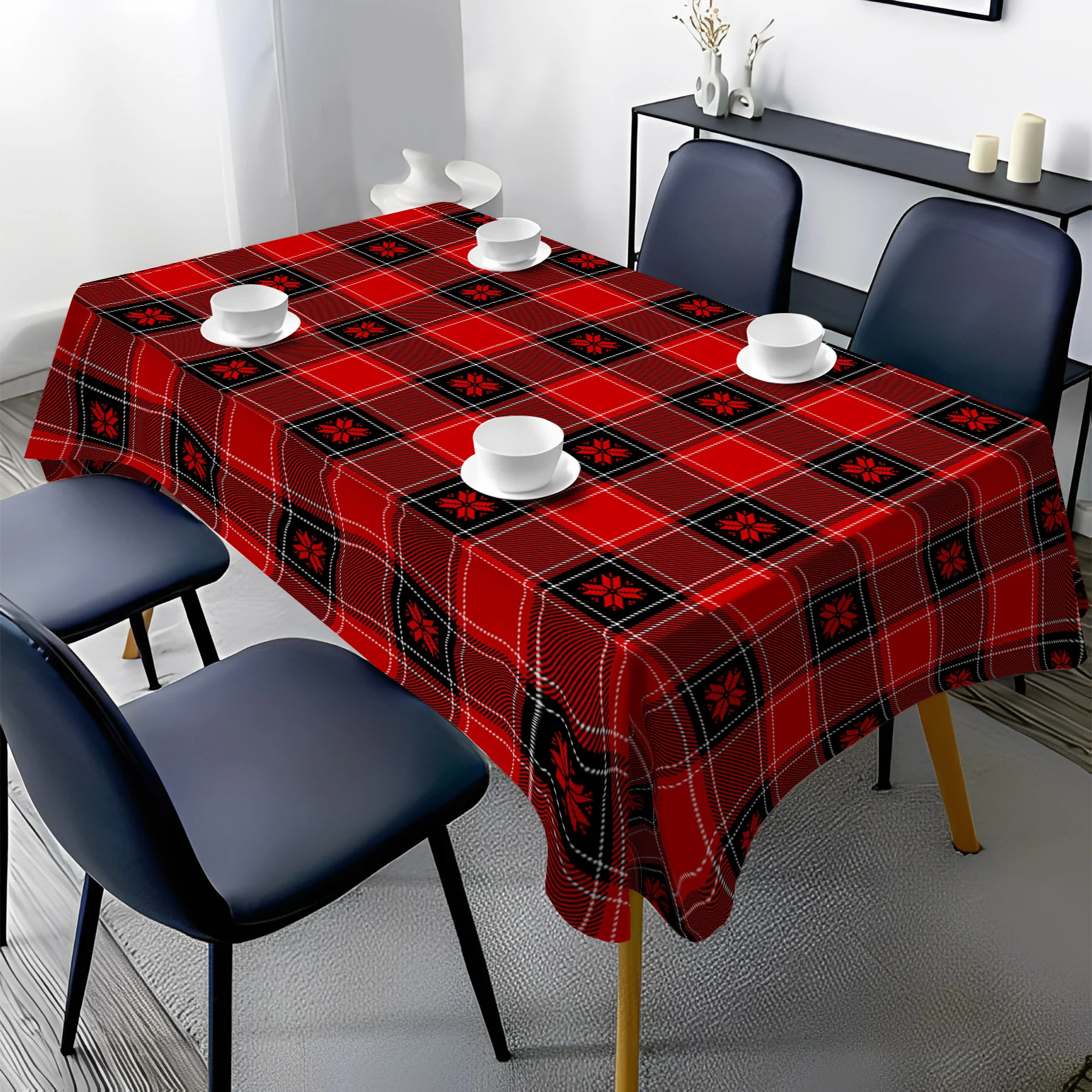 One red and black check-patterned polyester tablecloth for Christmas-themed use.