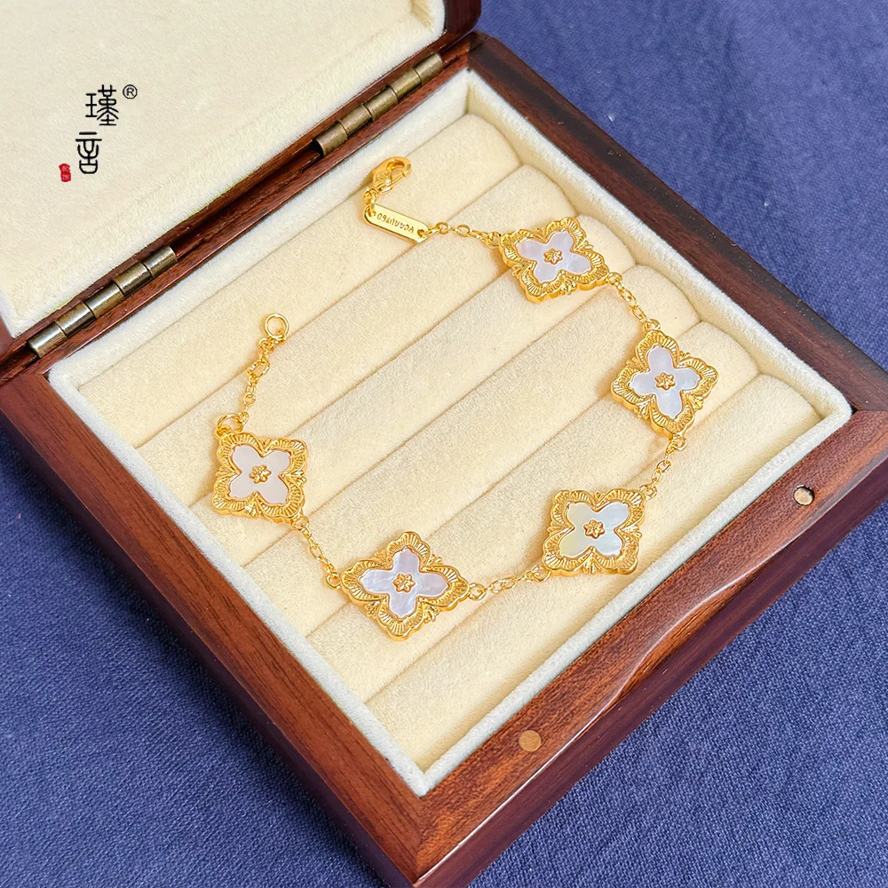 

Gold Shop 24K real gold lucky grass bracelet ins niche design high-end au999 real gold bracelet new shell hand jewelry