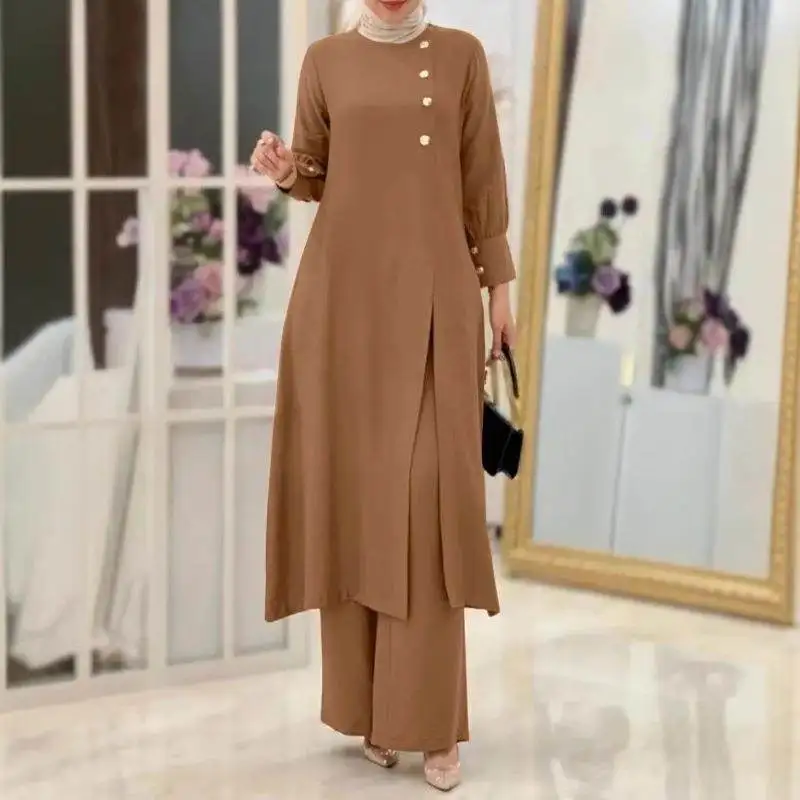 

Комплект из двух предметов: однотонный асимметричный длинный топ и широкие брюки для мусульманок, модный повседневный костюм.