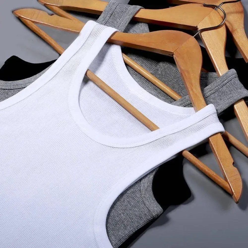 เสื้อกล้ามผู้ชายผ้าฝ้ายแท้ Four Seasons รุ่นใหม่ ปี 2026 ทรงพอดีตัว สำหรับวัยรุ่น ออกกำลังกาย ฟิตเนส วัยกลางคน สวมใส่สบาย ไม่มีแขน
