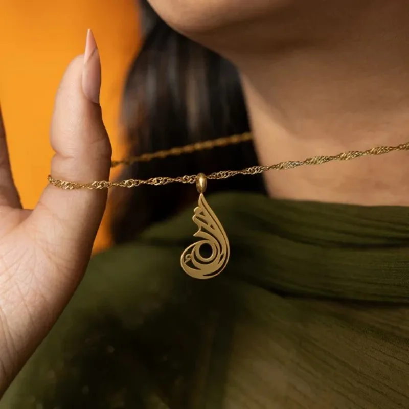 

Necklaces The Arabic Calligraphy for "serenity" Mirrors the Soft Flow of Inner Calm, Shaped to Reflect Purity and Presence