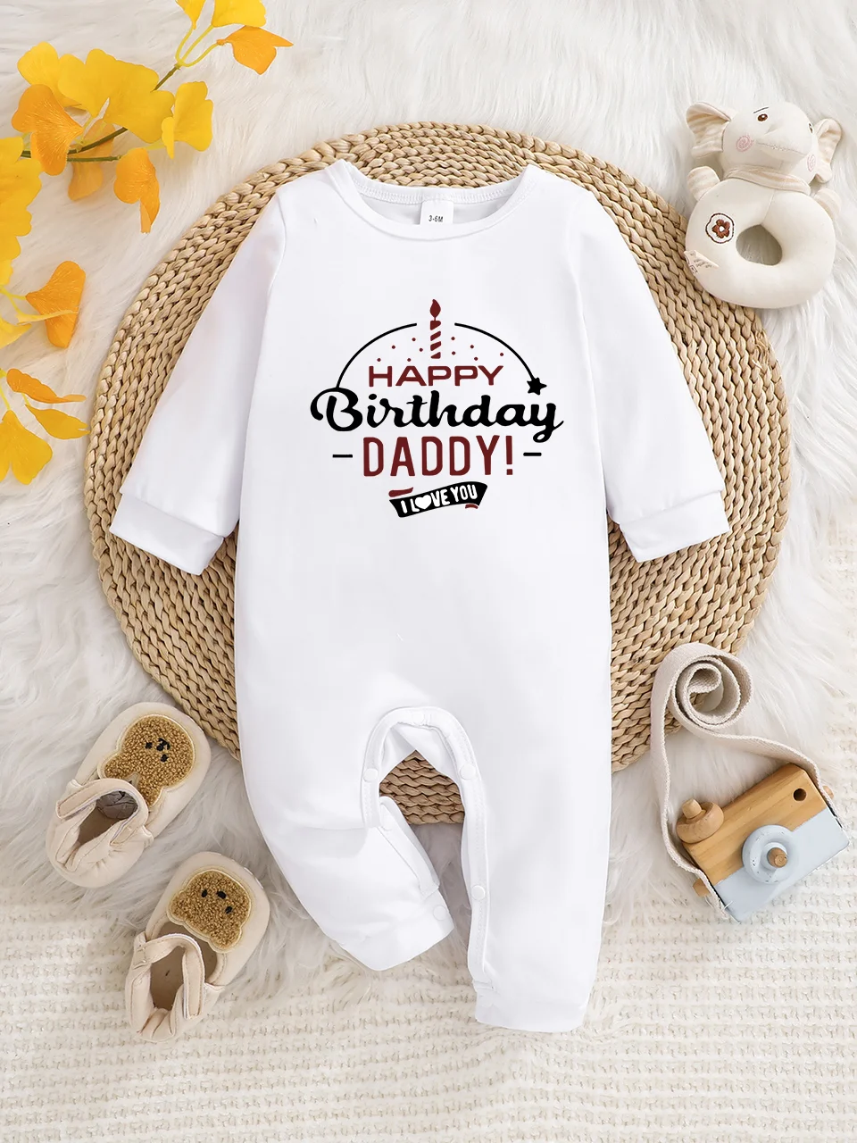 A baby long-sleeved onesie with interesting letter prints. It features a buttoned design for easy putting on and taking off