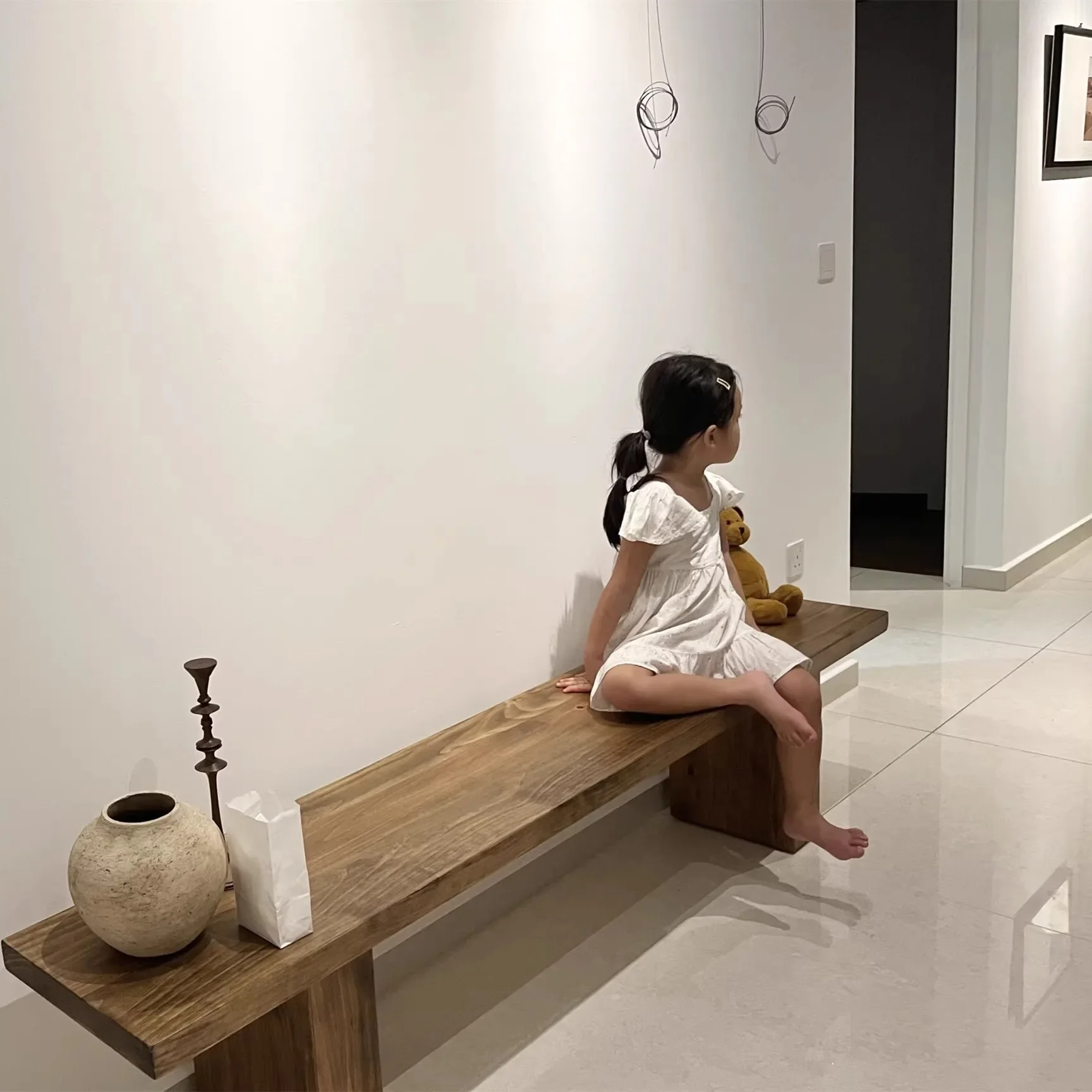 

Nordic solid wood long stool designer personalized furniture simple modern home shoe changing rest shoe dining stool