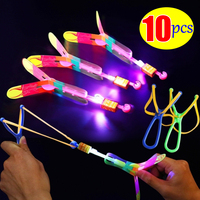 Lots Round Whistle Flying Sword Toys LED Blue/flash Rubber Slingshot Catapult Toy Children's Mini Flying Machine Toy Gifts