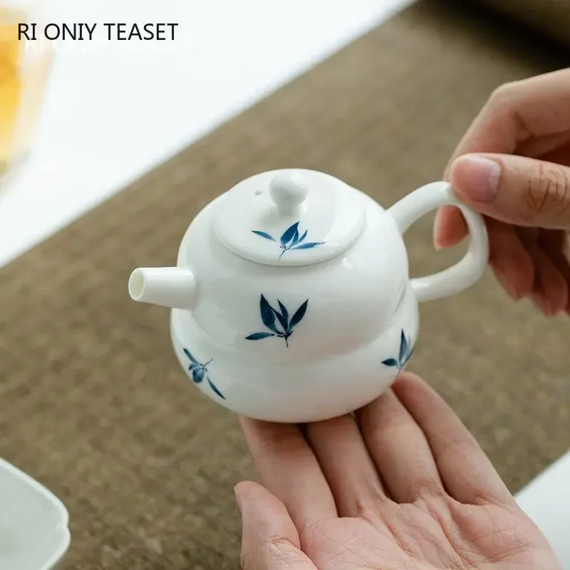 

Chinese Hand-painted Orchid Flowers Ceramic Teapots Handmade White Porcelain Tea Pot Beauty Tea Infuser Kettle Travel Teaware