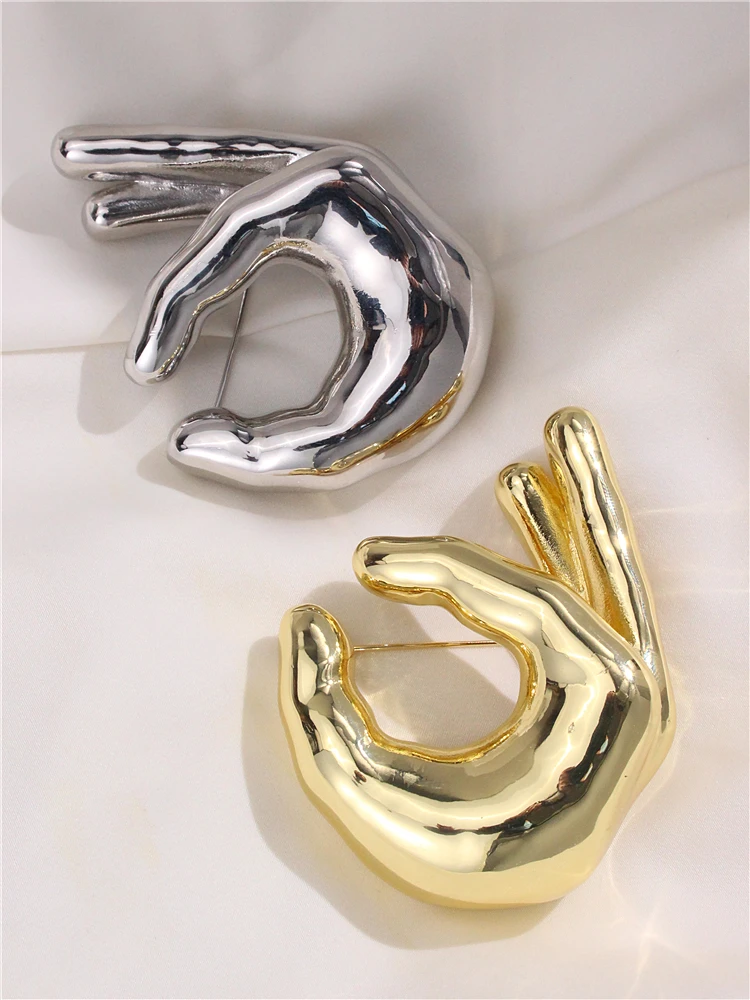 HUANQI New Glossy Metal Large OK Gesture Hand Palm Brooch for Women Girls Match Suit Shawl Pins Creative Design Accessories