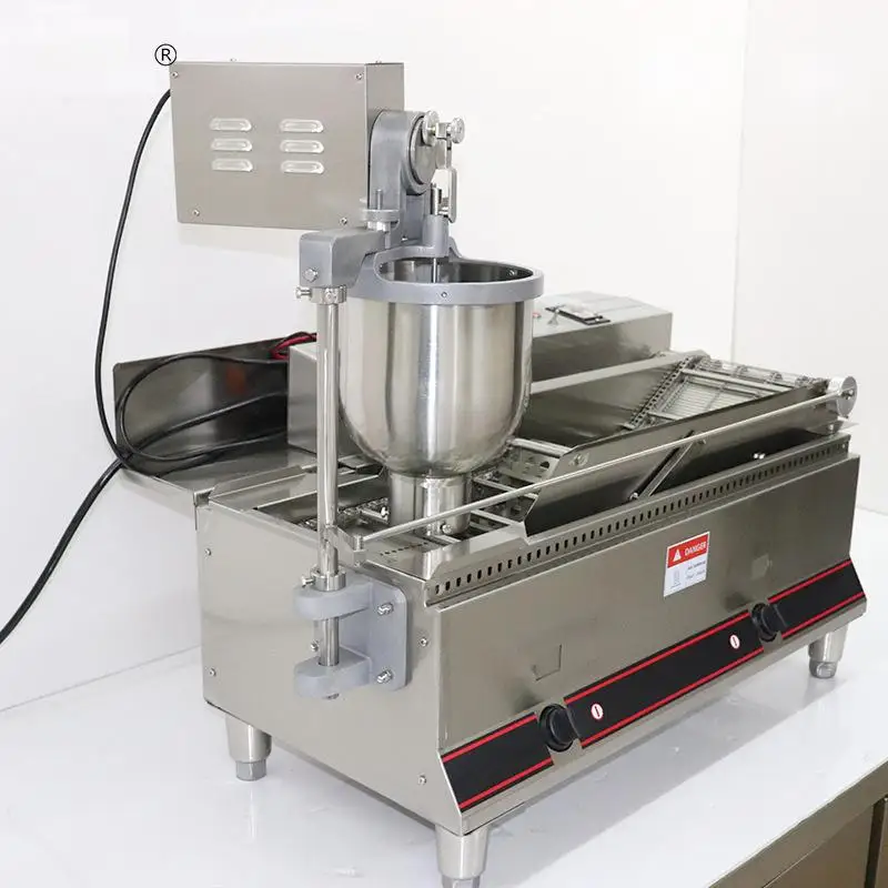 Friggitrice per ciambelle completamente automatica OEM Macchina per pasta elettrica Macchina per fare ciambelle in acciaio inossidabile per uso alimentare commerciale