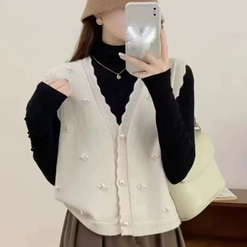 

Женский корейский стиль 2025 SS AA, новый свободный кардиган с жемчужной пуговицей и v-образным вырезом, расшитый бисером, с волнистыми краями, вязаный жилет, универсальная накидка, хит продаж