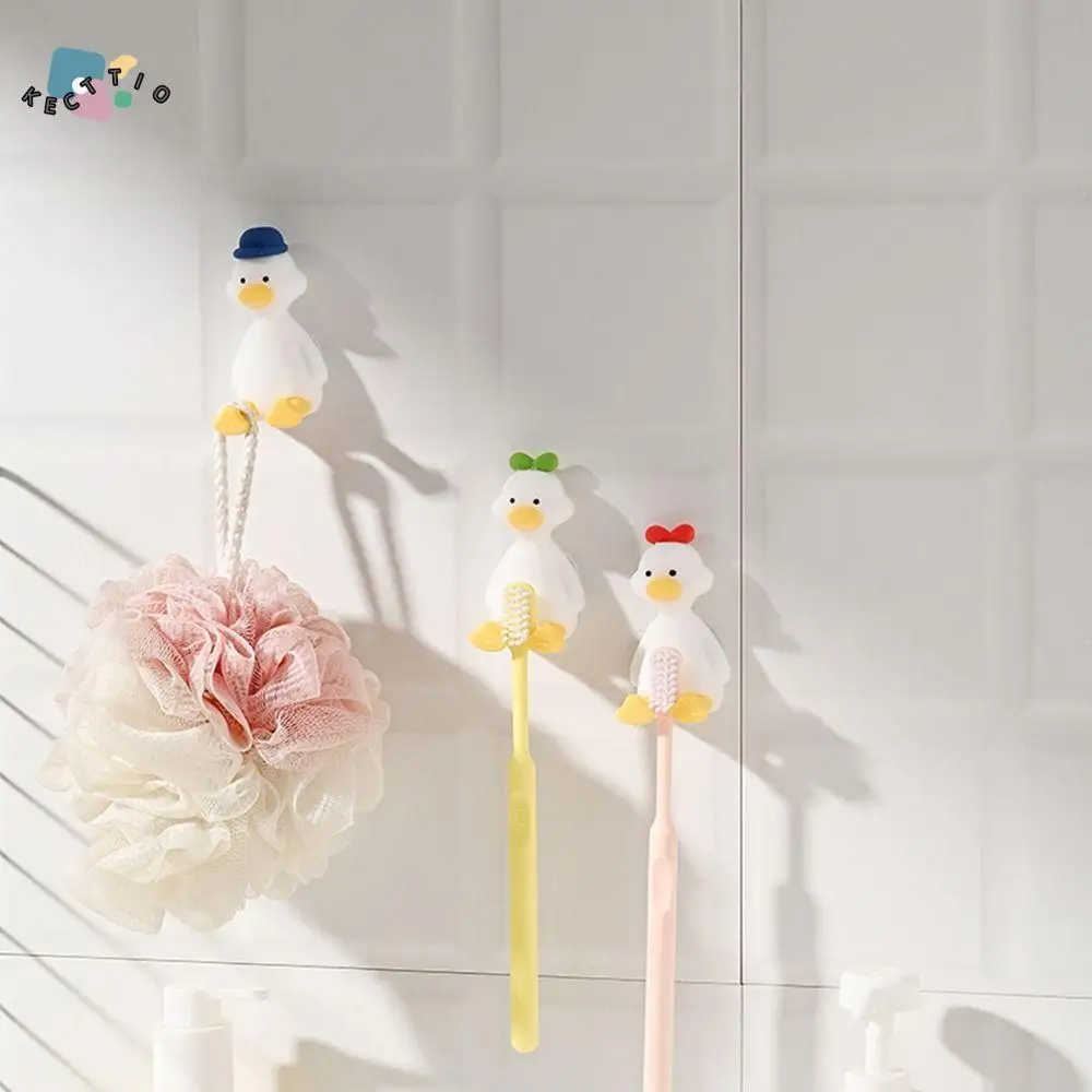 

Силиконовый держатель для зубных щеток в форме утки, трехмерный экономит место, крючок для хранения на присоске, бесплатная перфорация, подставка для зубных щеток для дома