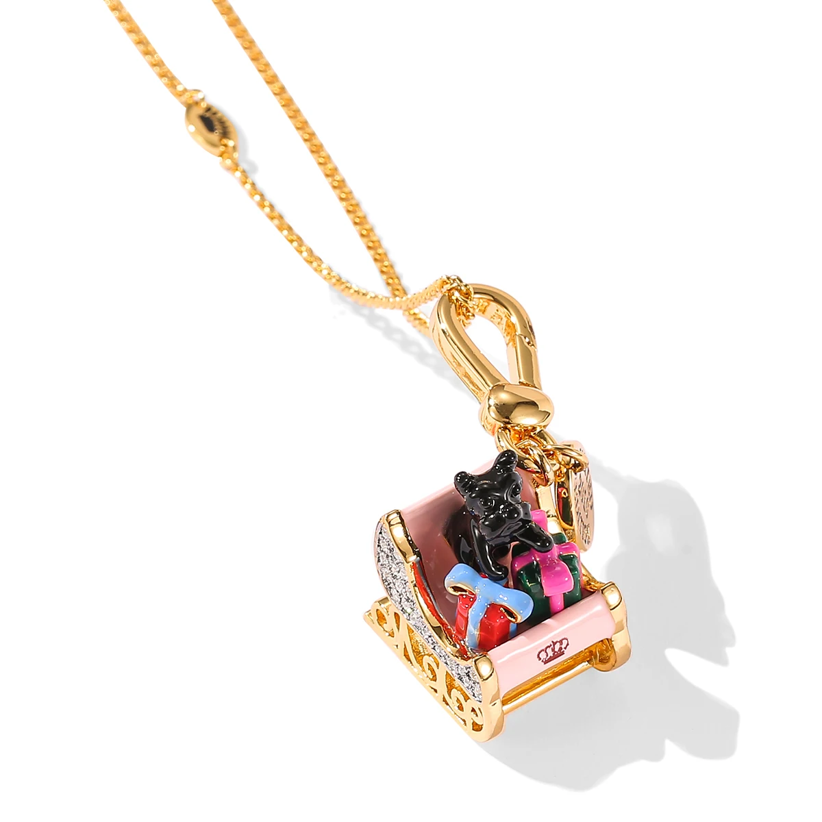 

Exquisite and versatile enamel glaze pink sleigh pendant necklace cute and stylish black puppy key chain Christmas gift.