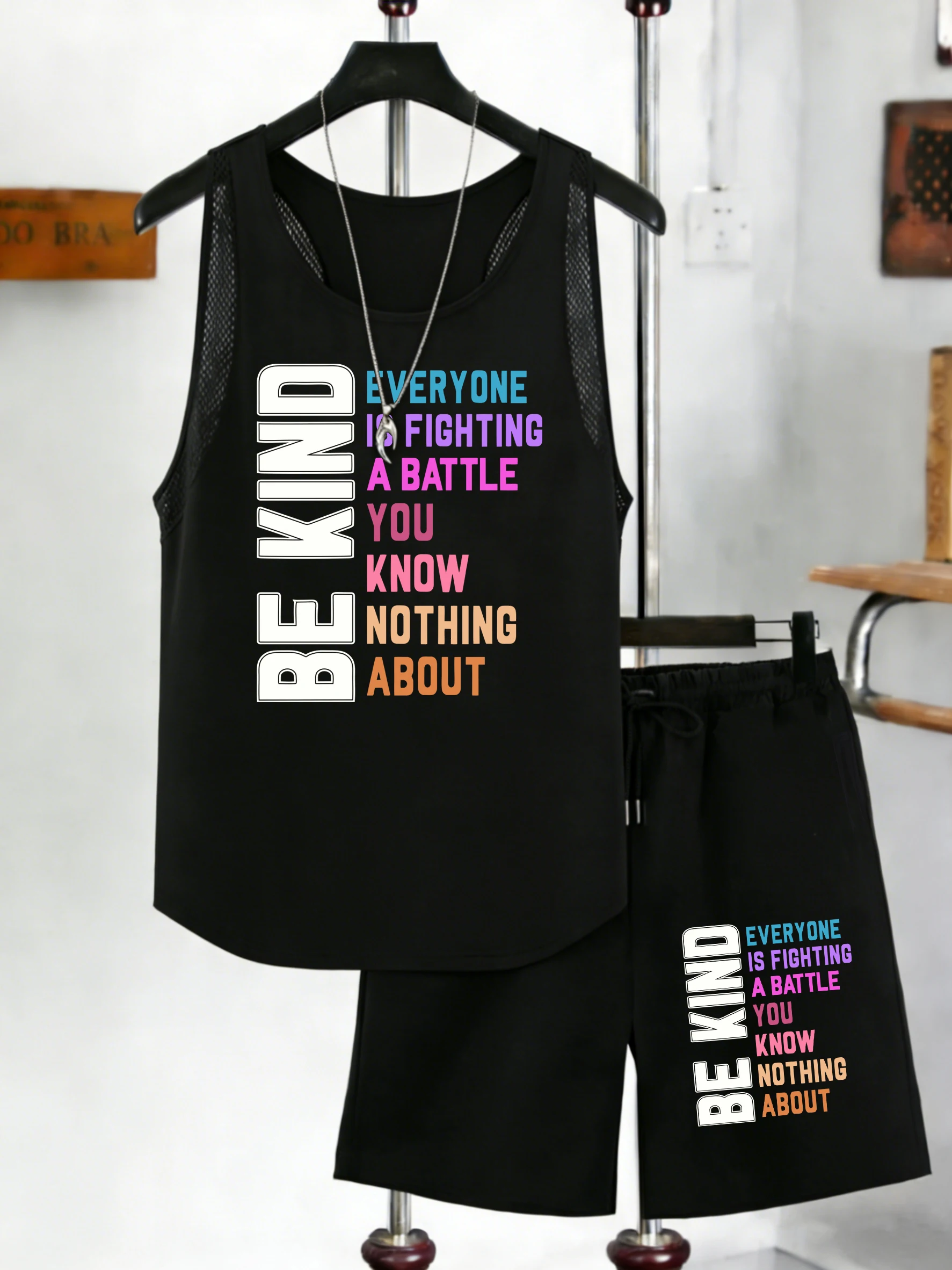 

Комплект: Майка-жилет с цветным принтом и надписью, летние широкие шорты с карманами на шнурке.