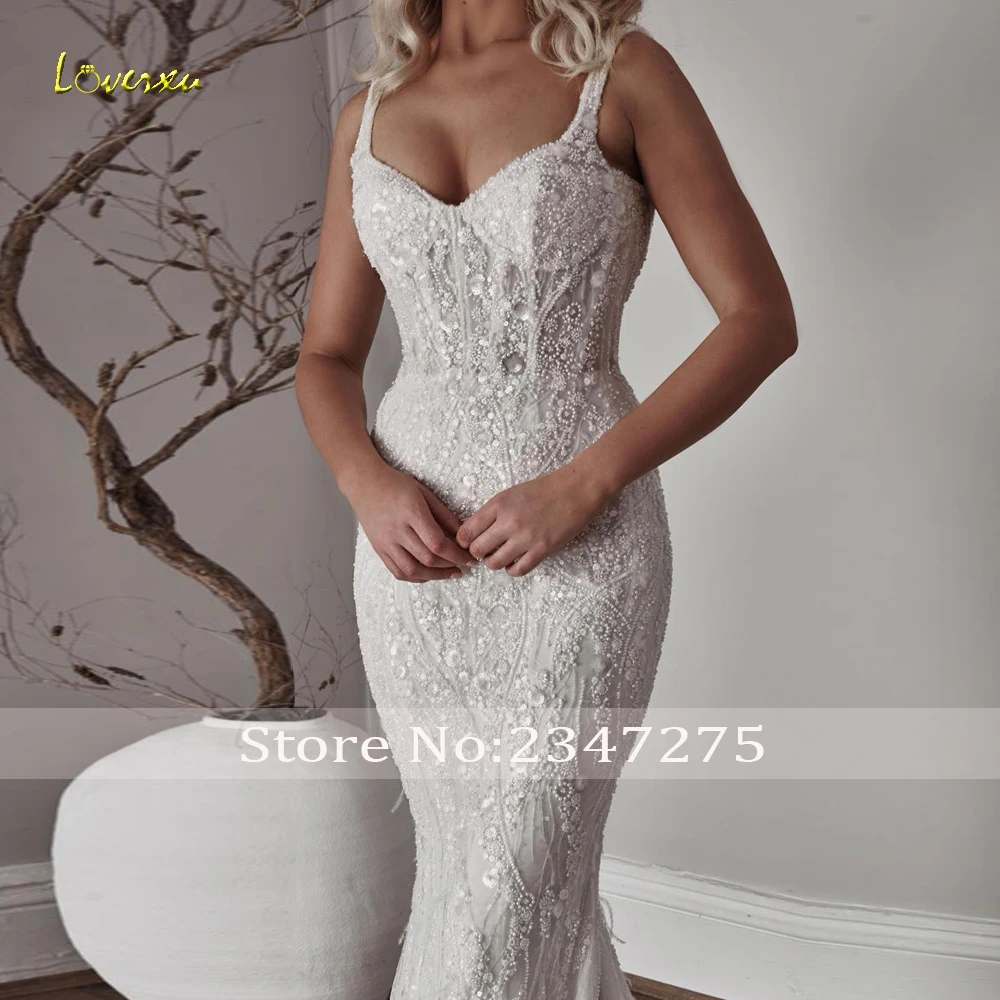 Loverxu حورية البحر فساتين زفاف مثيرة على شكل قلب بدون أكمام فيستدو دي نوفيا دانتيل مطرز لامع مصنوع حسب الطلب فستان زفاف