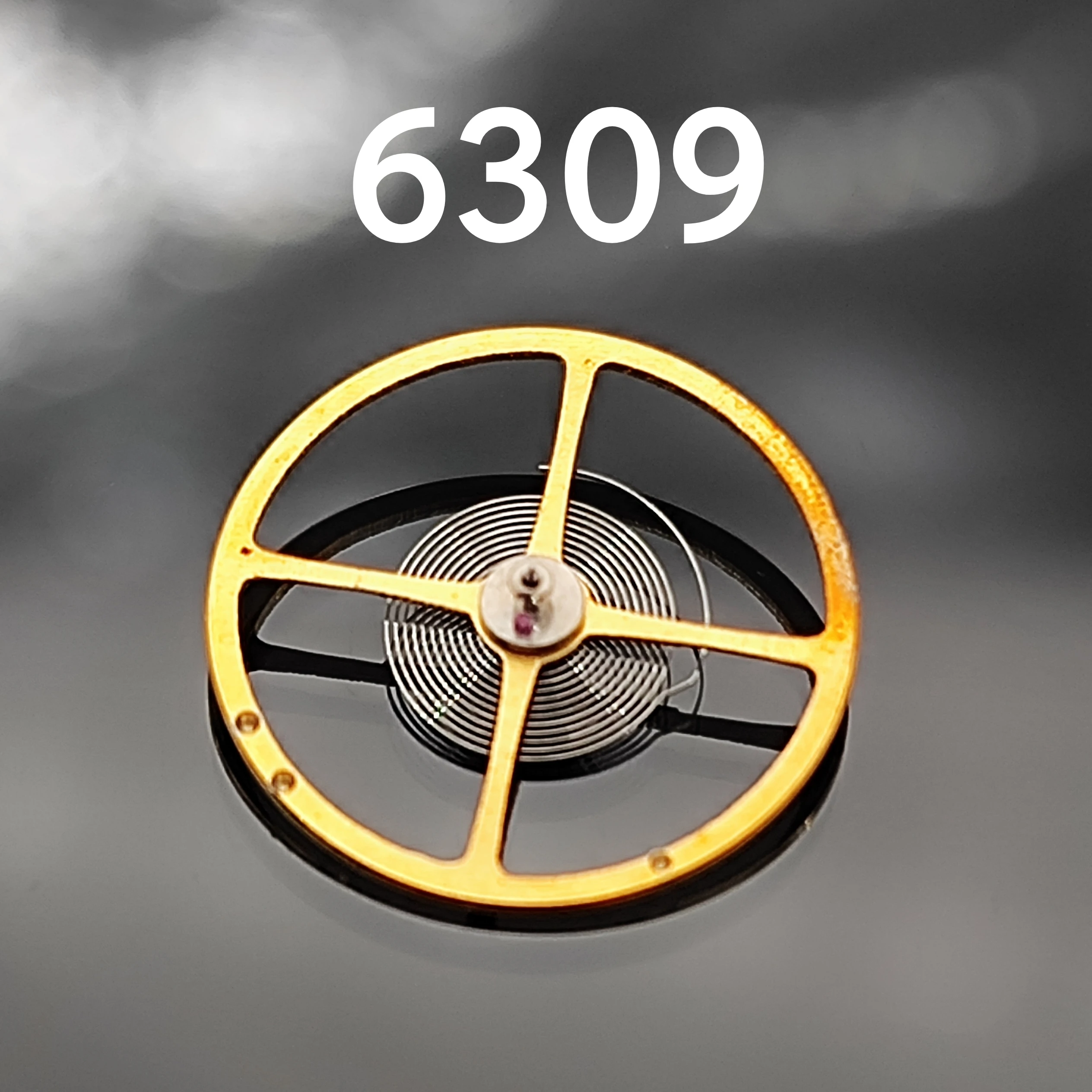 Accesorios para relojes hechos en China 6309 Rueda de equilibrio Movimiento mecánico antiguo 6309 Rueda de equilibrio de oscilación completa (con cable de aceite)