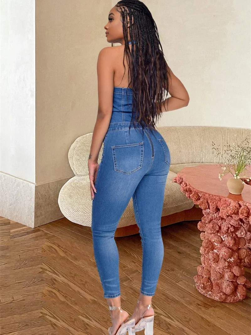 จั๊มพ์สูทเดนิมสไตล์สตรีทแวร์ เสื้อผ้าฤดูร้อนสำหรับผู้หญิง แขนกุด เปิดหลัง ชุดจั๊มพ์สูทยีนส์แบบชิ้นเดียว ชุดเอี๊ยม