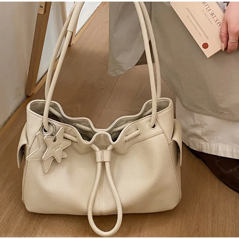 

Drawstring Pleated Shoulder Bag For Spring 2026 New Korean Niche High-value Simple Strap With Casual Style And Underarm Handbag