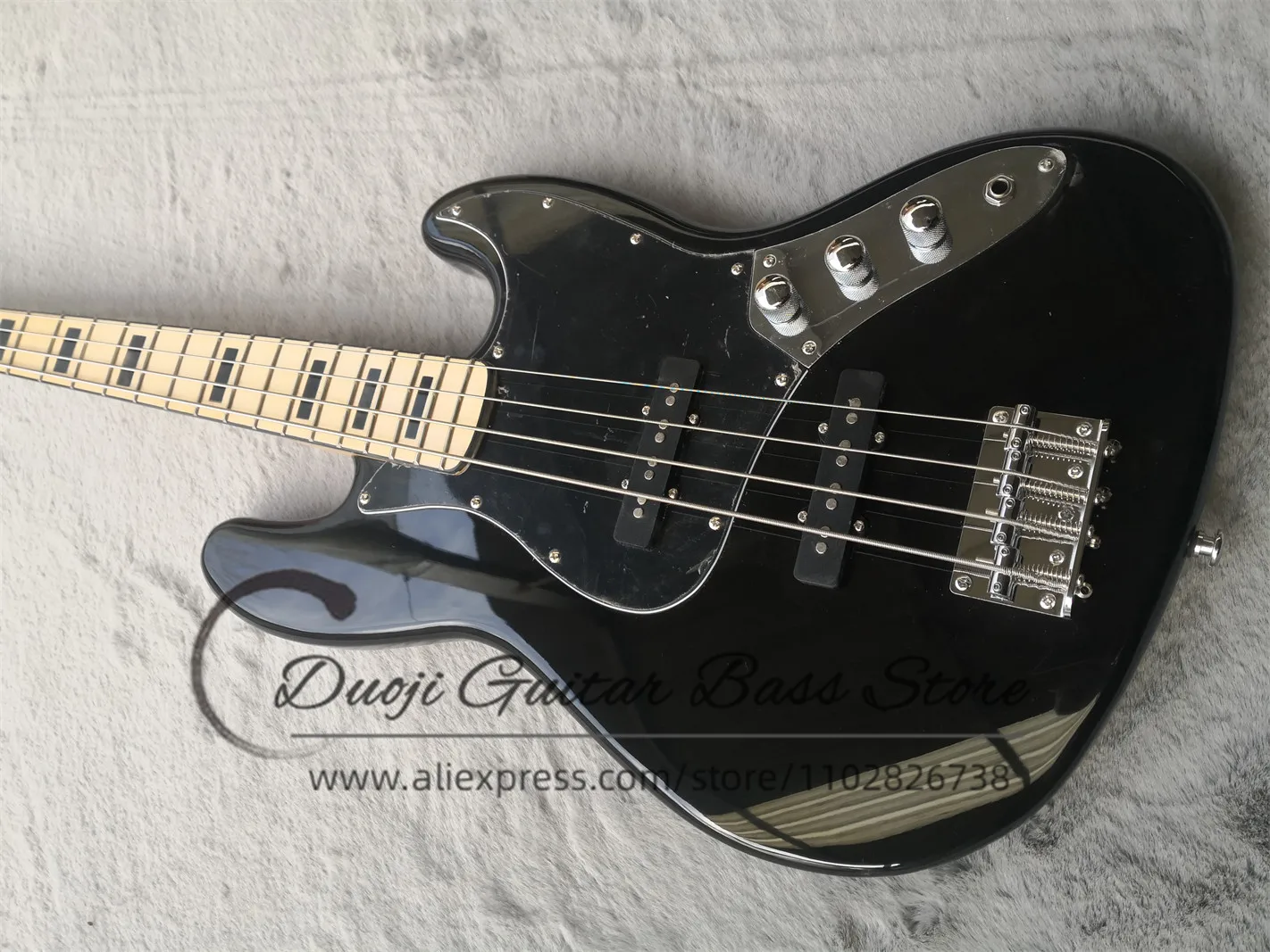 4 string black bass guitar, solid wood body, maple neck, black square inlaid maple fingerboard, fixed bridge, black guard