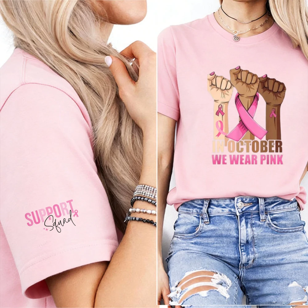 In October We Wear Pink Raised Fist Graphic T-Shirt Support Squad Script Cuff Graphic Breast Cancer Survivor Empowerment Tee Top