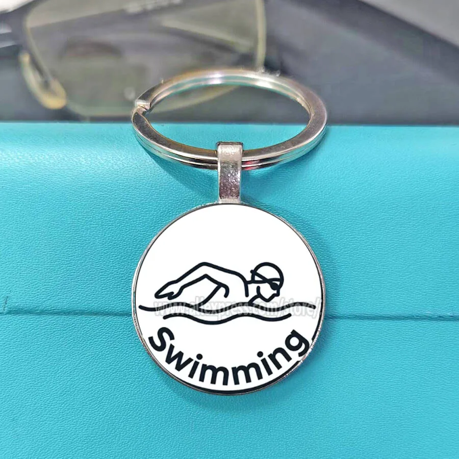 Hot Sale Elegant Black Background Swimming Theme Glass Keychain Popular Sports Style Unisex Bag Car Daily Charm Gift