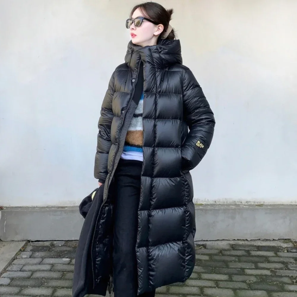 Manteau en duvet d'oie blanc chaud nouveau 2025 noir or huit grilles femmes veste longue épaissi stockage de chaleur à la mode doudoune