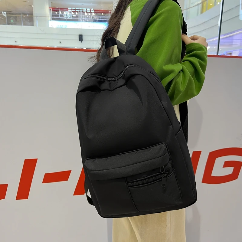 シンプルなソリッドカラーのカジュアルバックパック、軽量で多用途な高校生バッグ、ハンギングアウト用の多用途なソリッドカラーのデイパック