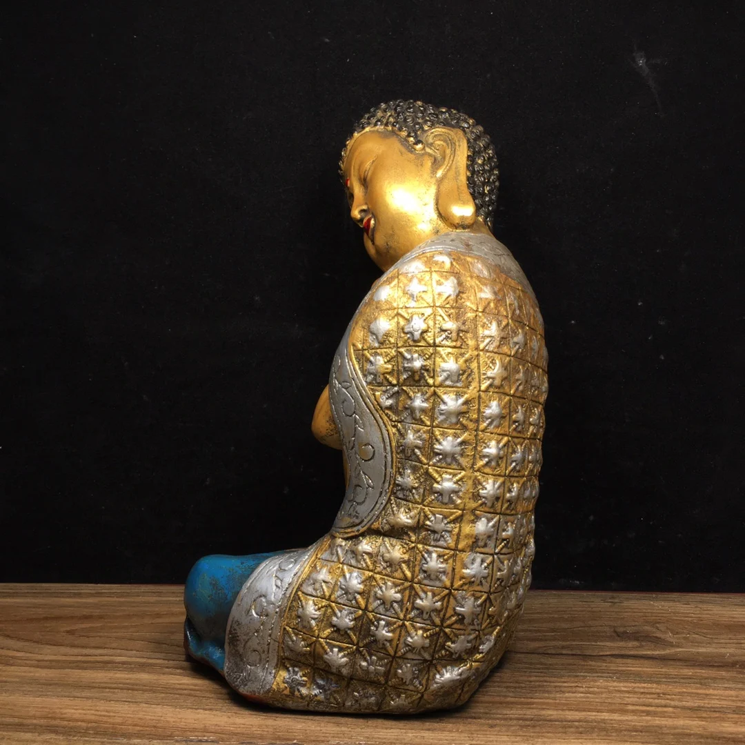 pure copper painted Buddha statue is 16 centimeters long, 14 centimeters wide, 23.5 centimeters high, and weighs 3400 grams