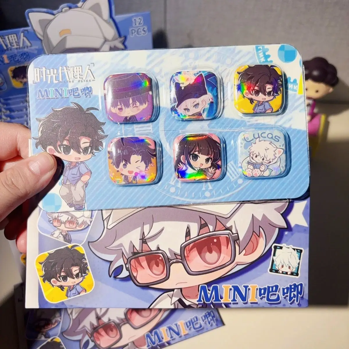 Time Agent Mini Square Kiss Collectible Box - One pack contains 6 randomly selected cartoon-shaped tin badges. view 2
