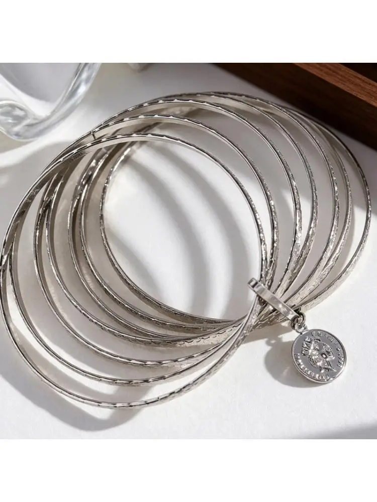 A52E Handcrafted Multi Strand Hammered Alloy Bangle Decorated With Historical Coin Pendant
