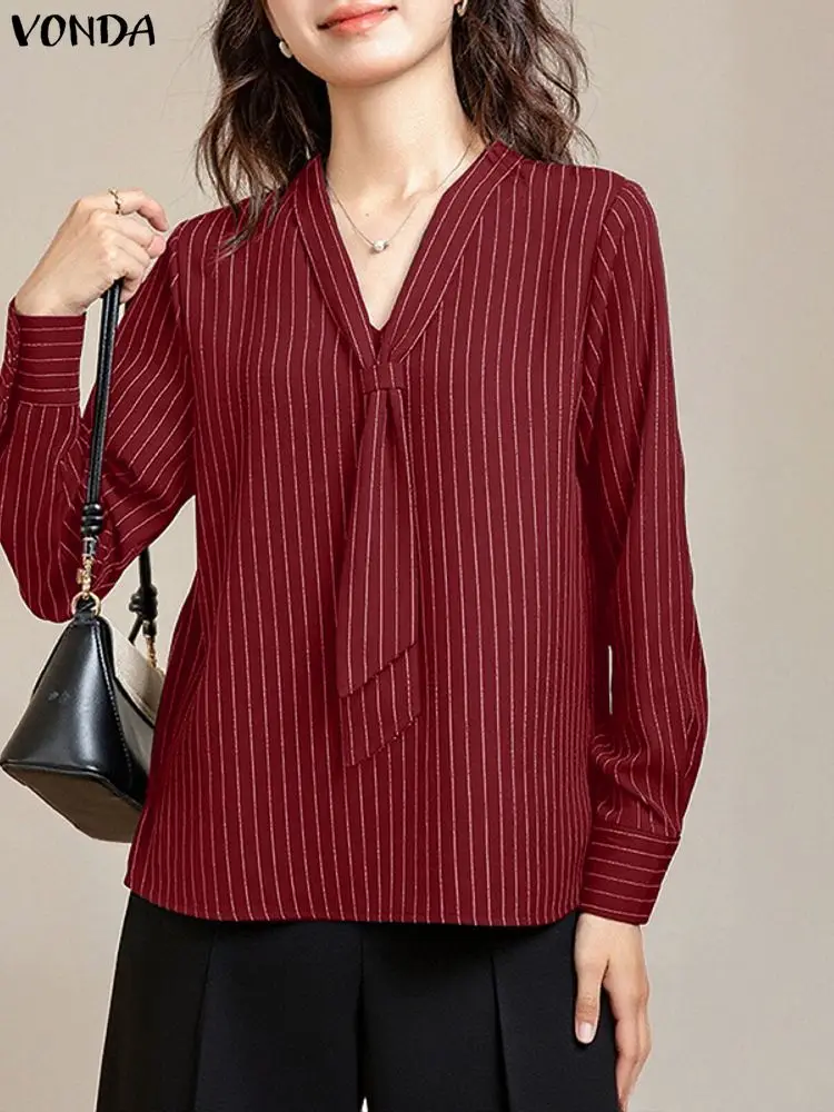 Elegancka bluzka damska VONDA do biura, dekolt w serek, koszule w paski, moda 2025, długi rękaw, luźny krój, nadruk, bluzki damskie do pracy.