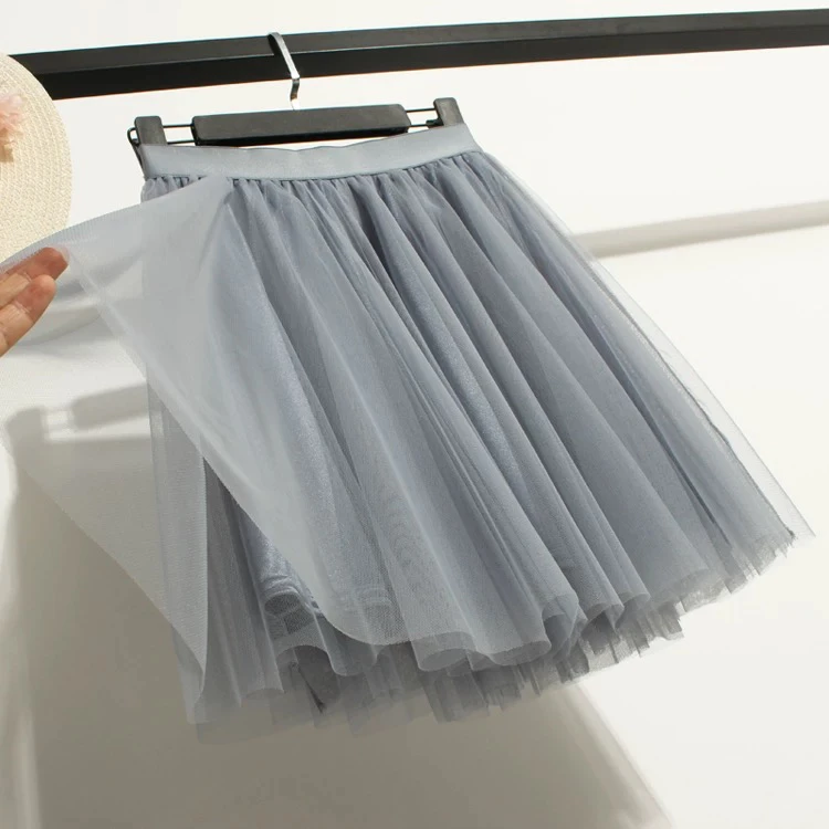 تنورة قصيرة بيضاء على شكل حرف A للسيدات موضة الربيع والصيف تنورة كورية على شكل مظلة شبكية تنورة عالية الخصر نصف الجسم
