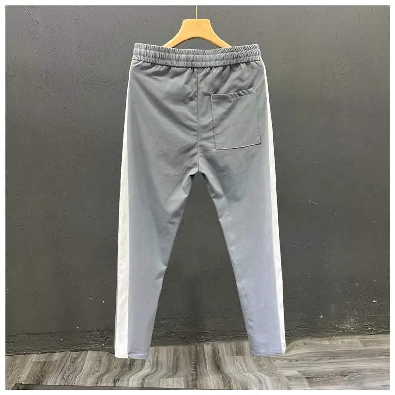 عارضة الرياضة الرجال مستقيم الساق رقيقة تمتد السراويل الخريف Faion العلامة التجارية المرقعة اللون السراويل الطويلة Sli تسع نقاط