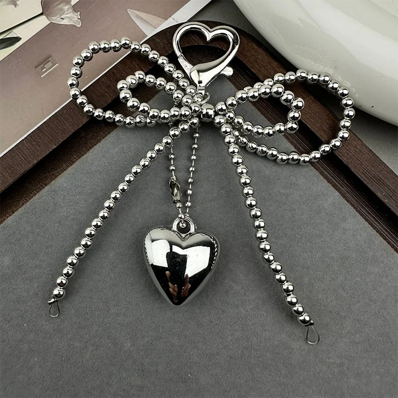 حقيبة جديدة على شكل فيونكة لؤلؤية على شكل قلب مصنوعة يدويًا لحقيبة الهاتف وحقيبة الملابس والأحذية وإكسسوارات الحقائب