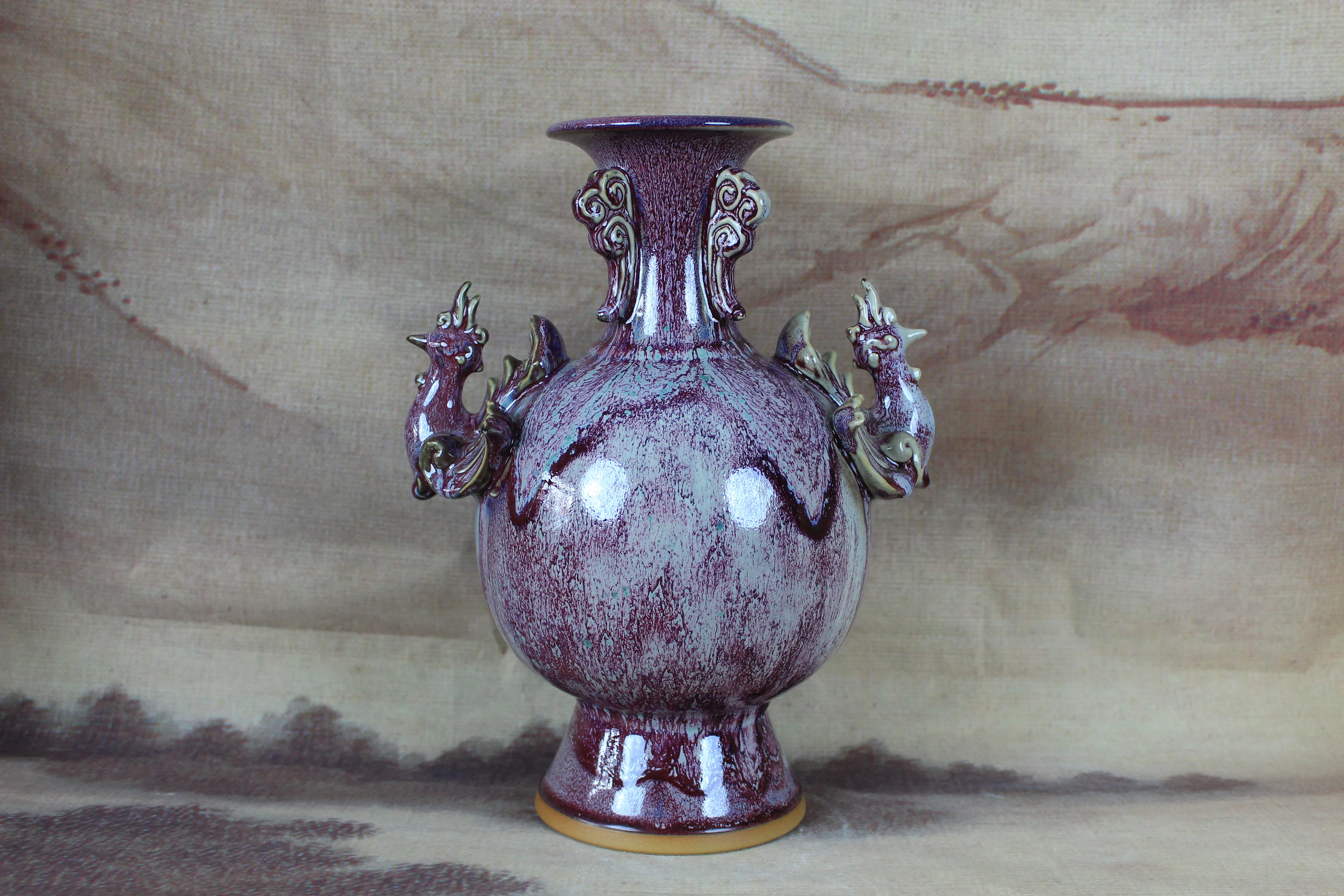 Jun Old porcelain with glaze of changing color and carving of phoenix bottle, collection decoration.
