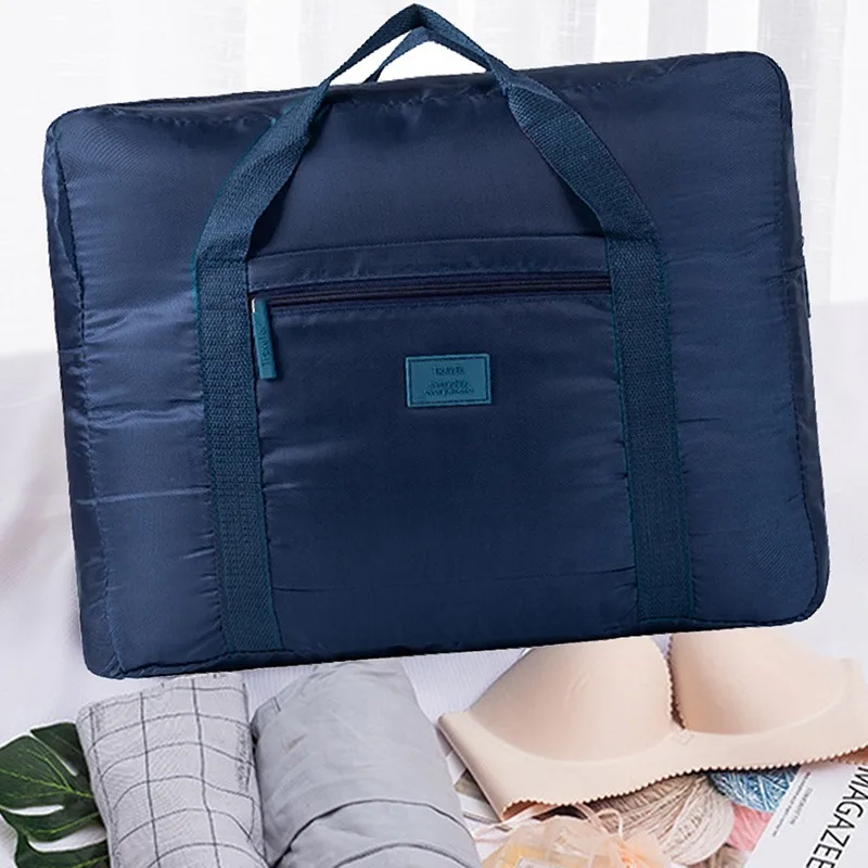 Bolsa de viaje plegable de alta capacidad para hombres y mujeres, bolsa de lona impermeable de nailon, organizador de ropa de mano, almacenamiento