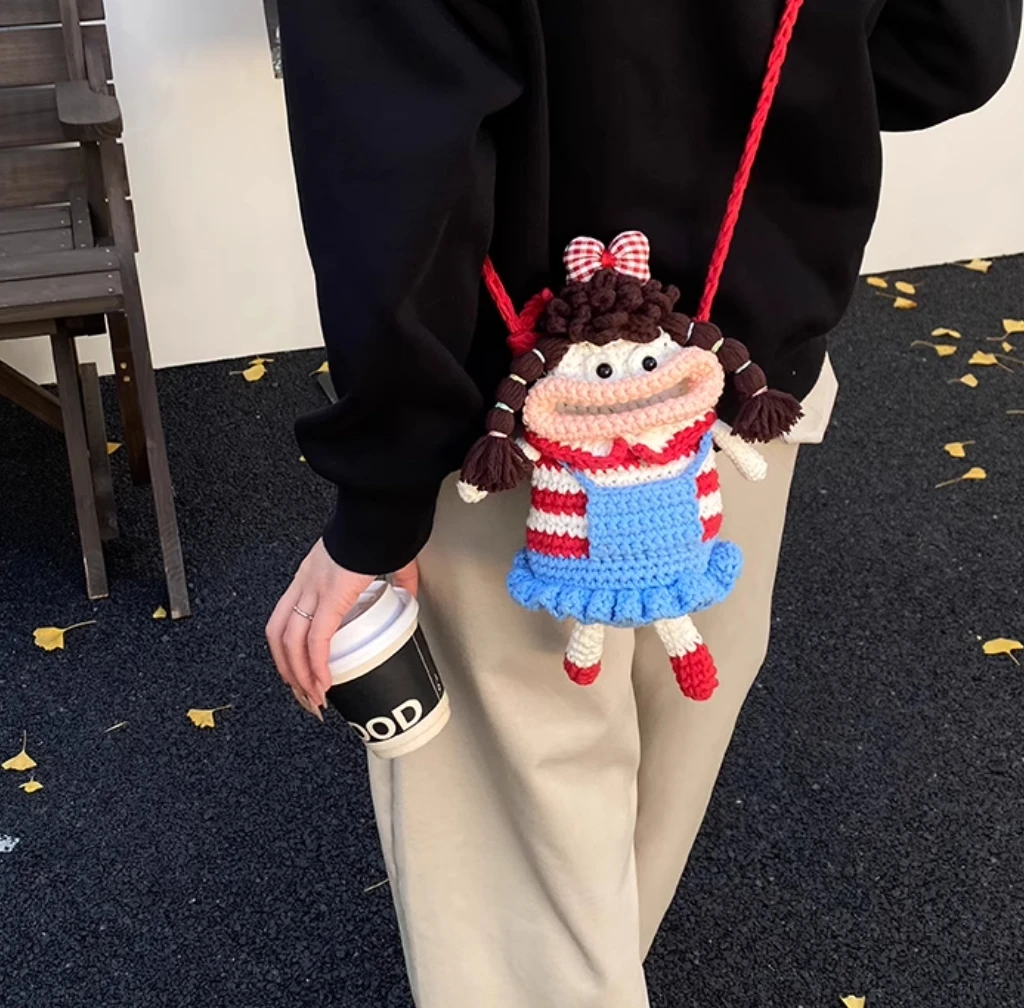 

Cute cartoon girl with big mouth mobile phone bag handmade diy knitted wool bag knitted crossbody bag finished creative gift