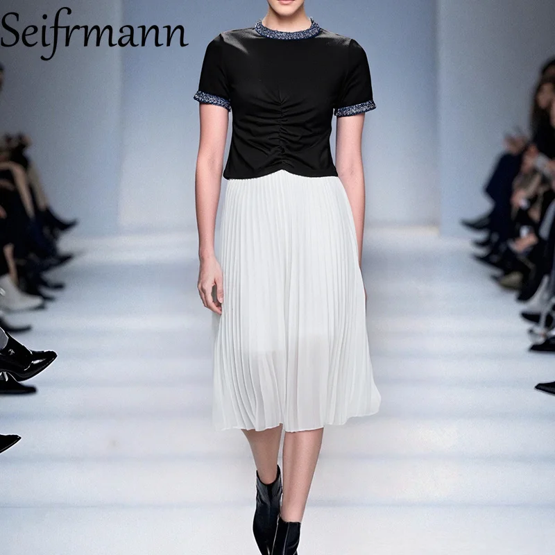 

Seifrmann Fashionable Lace Up Knit Top Paired With a Mid Length Pleated White Skirt Set, Decorated Waist Showcasing Intellec